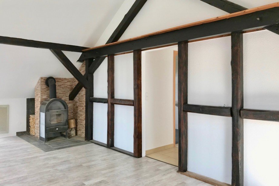 Wohnzimmer mit Kamin Dachgeschosswohnung Udestedt